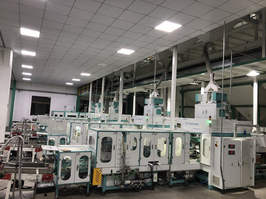 Vietnam rice factory automatic packaging line with QZB-900E vacuum packing machine and robotic palletizer